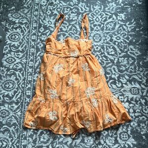 Orange dress with daisies